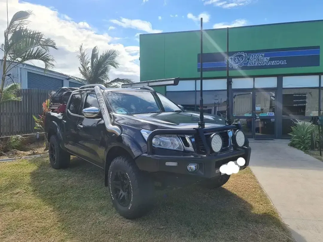A Black Truck Is Parked In Front Of A Green Building — M8S Rates Mechanical In Gladstone Central, QLD