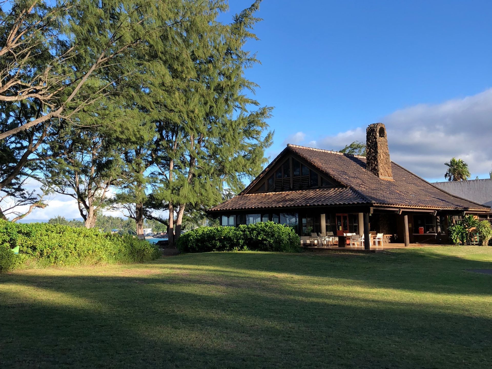 A large house with a large lawn in front of it