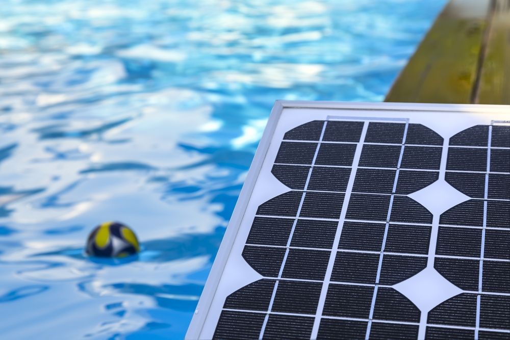 Solar Panel Near a Swimming Pool — Tempshift Pool Heating in Gosford, NSW
