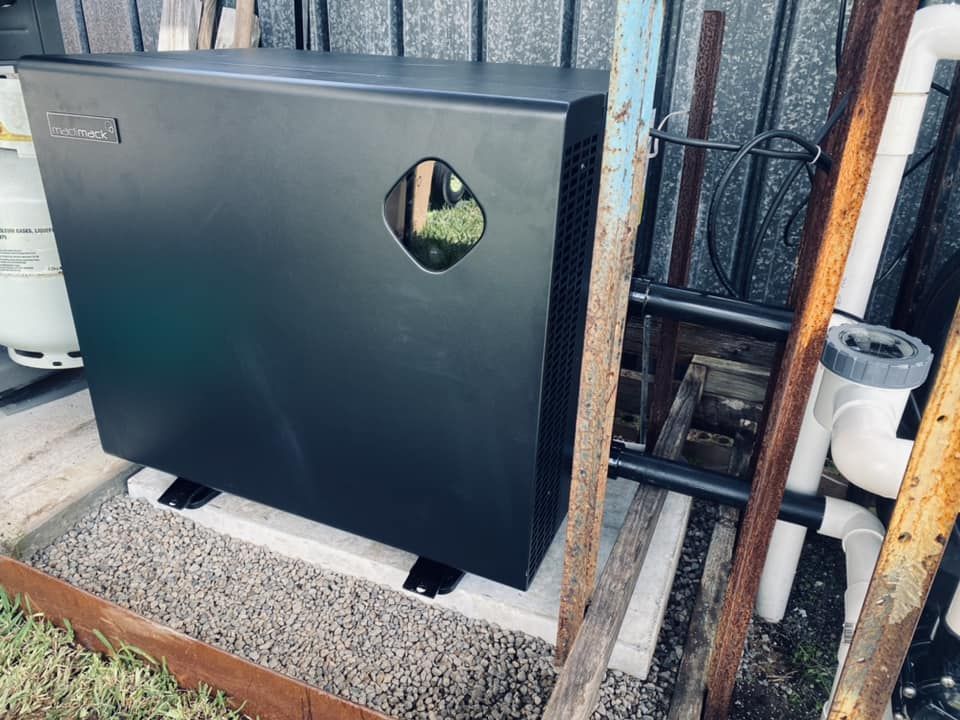 Black Pool Heater Sitting on a Concrete Base — Tempshift Pool Heating in Central Coast, NSW