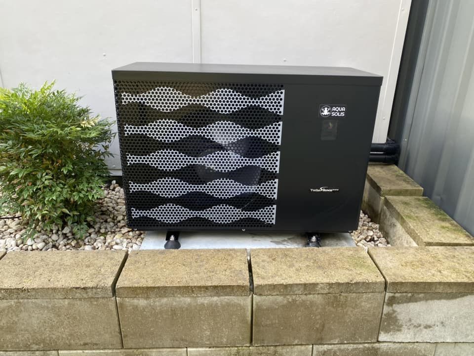 Black Heat Pump on a Concrete Base — Tempshift Pool Heating in Buff Point, NSW