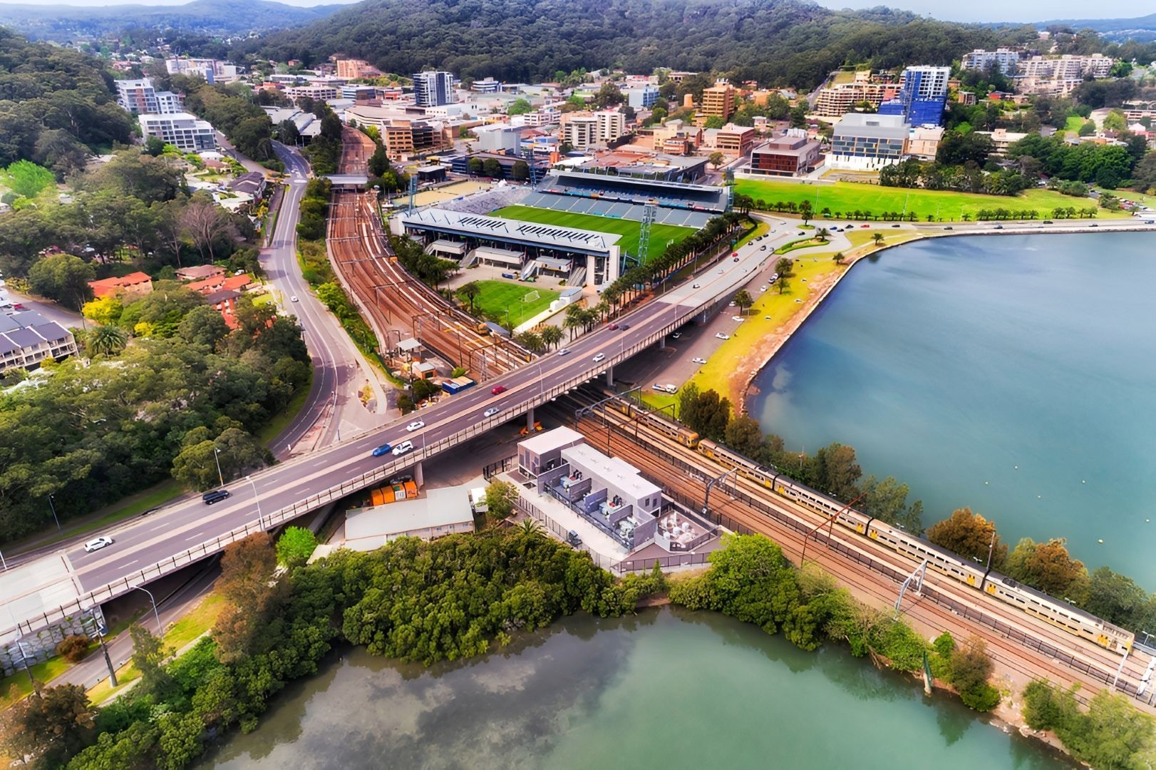 Aerial View of a City With Bridges Over Water, and Buildings — Tempshift Pool Heating in Gosford, NSW