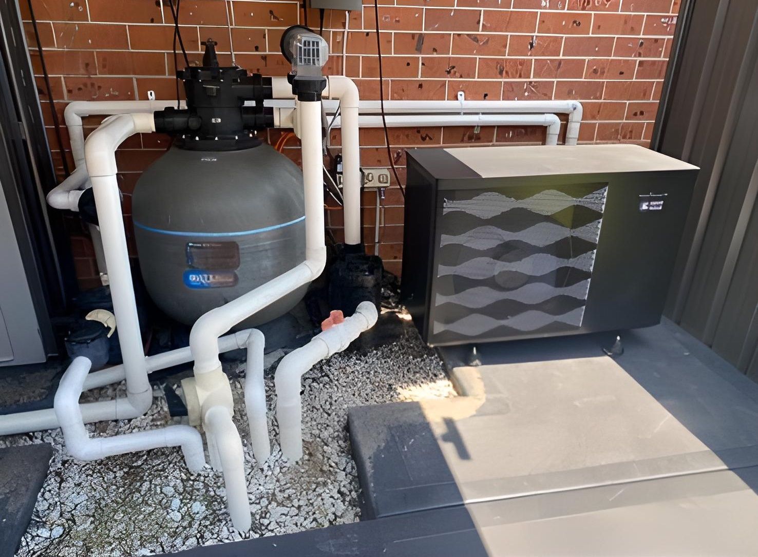 Pool Filter, Heater, and Pipes Against Brick Wall — Tempshift Pool Heating in Buff Point, NSW