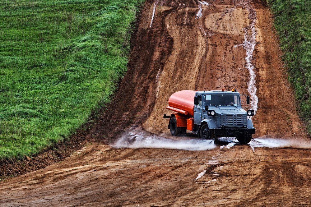 Worker Cleaning Construction Site — Rainman Domestic Water in Avoca, QLD