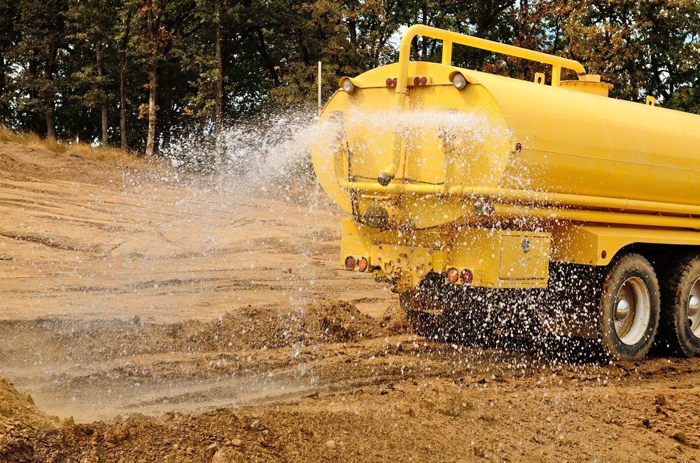 Water Truck Sprays Water on Soil — Rainman Domestic Water in Avoca, QLD