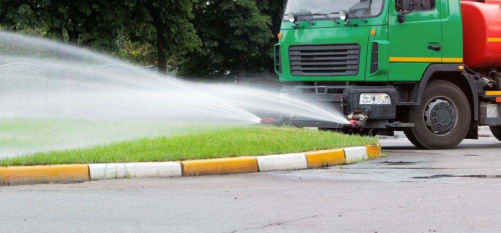 Truck Watering the Lawn — Rainman Domestic Water in Avoca, QLD