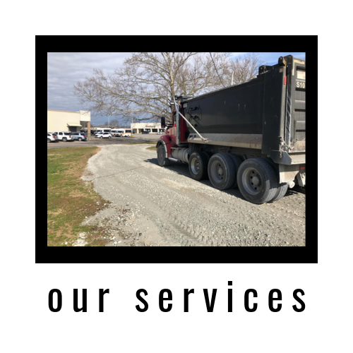 Dump truck on a gravel road at a worksite with “our services” text below.
