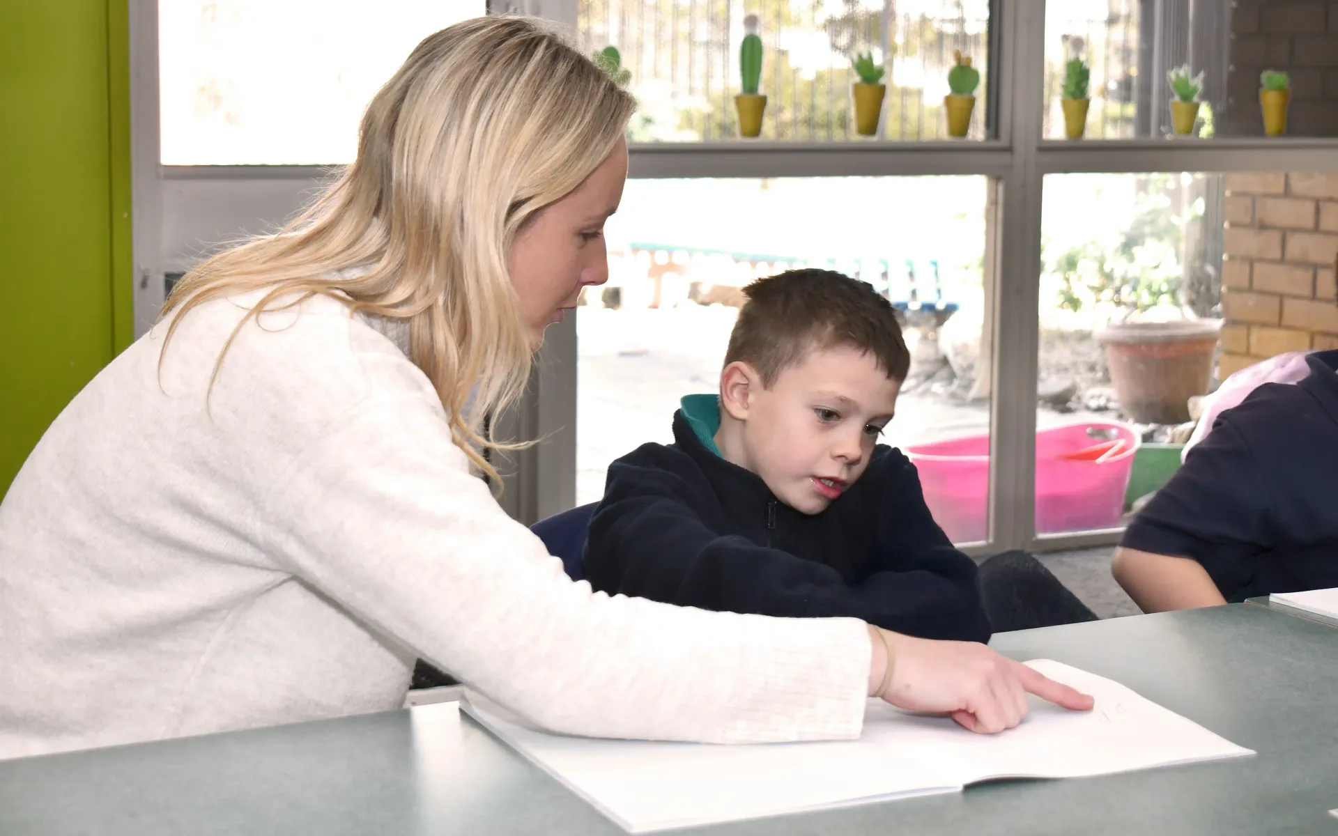 Teacher helping child at Ararat Primary School