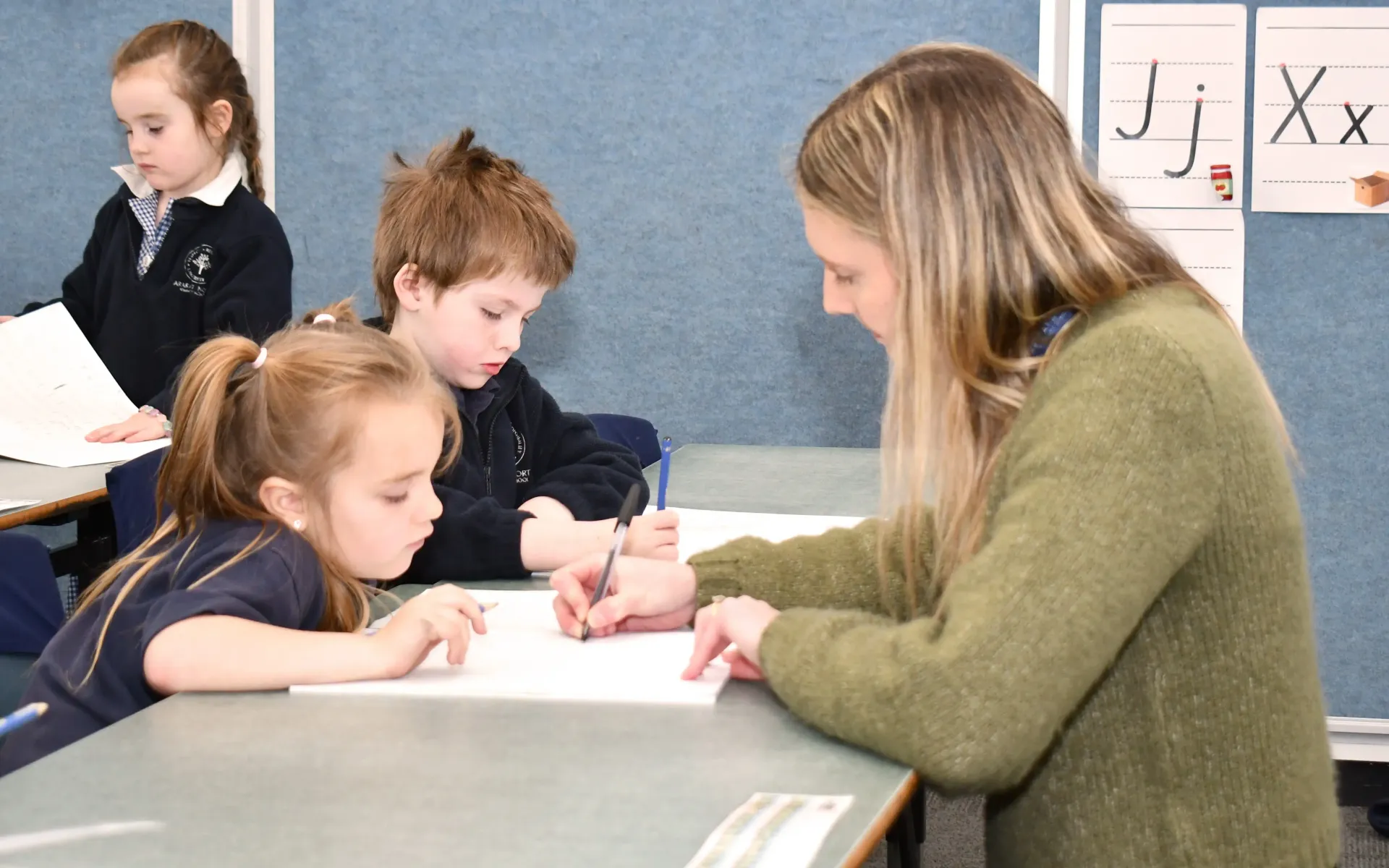 Teacher helping child at Ararat Primary School