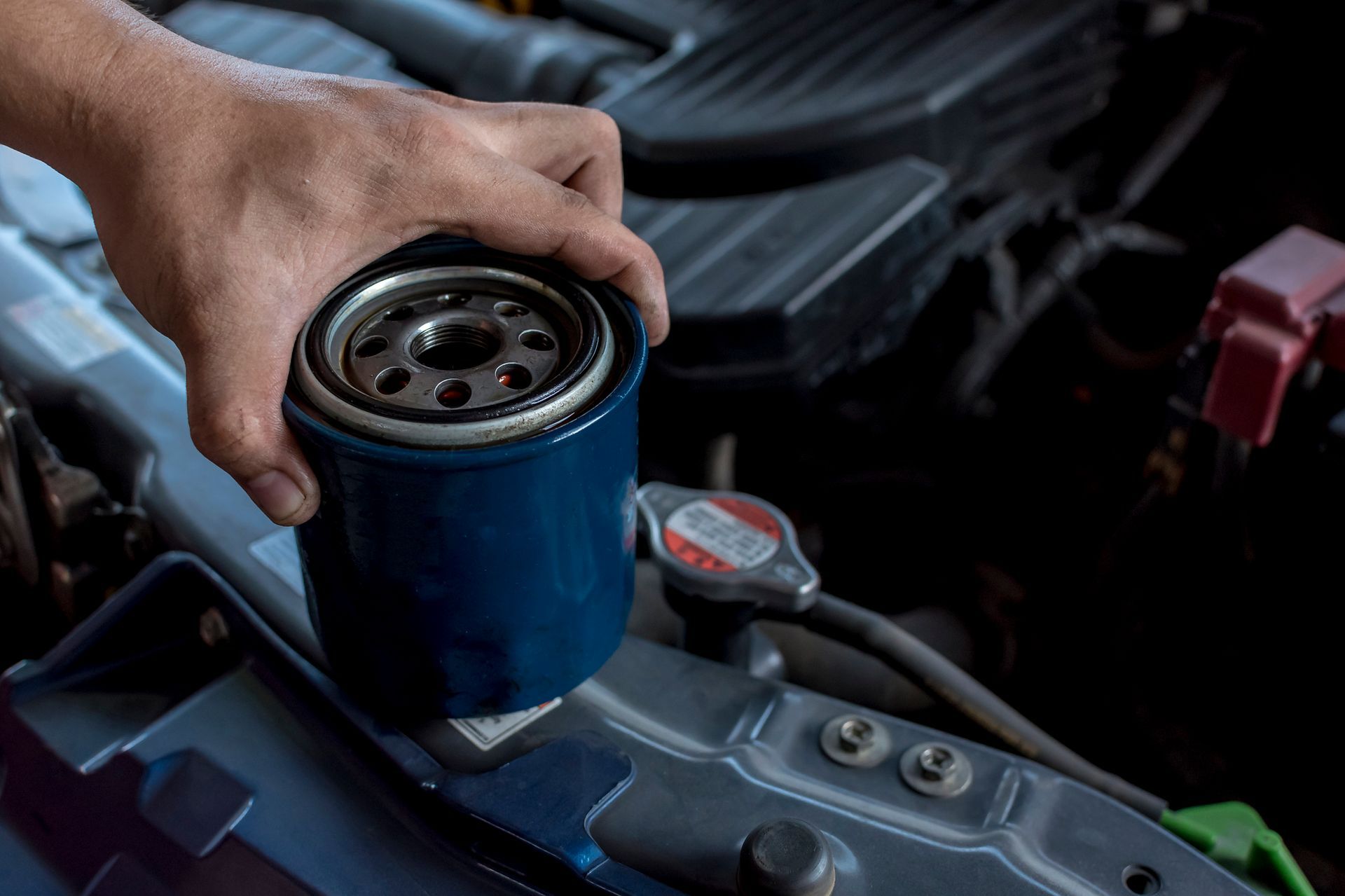 Premium Amsoil oil change component Ea filter next to labeled box showing brand and product formula. Premium Amsoil oil change component Ea filter next to labeled box showing brand and product formula.