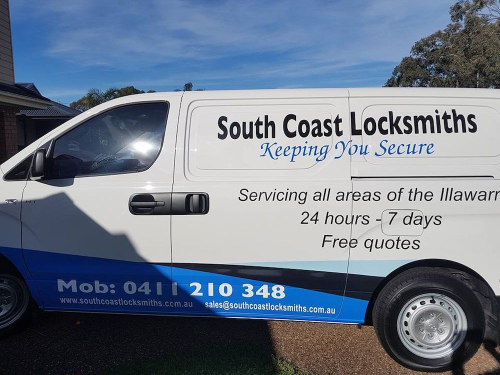 A South Coast Locksmiths Van is Parked in Front of a House — South Coast Locksmiths in Fairy Meadow, NSW