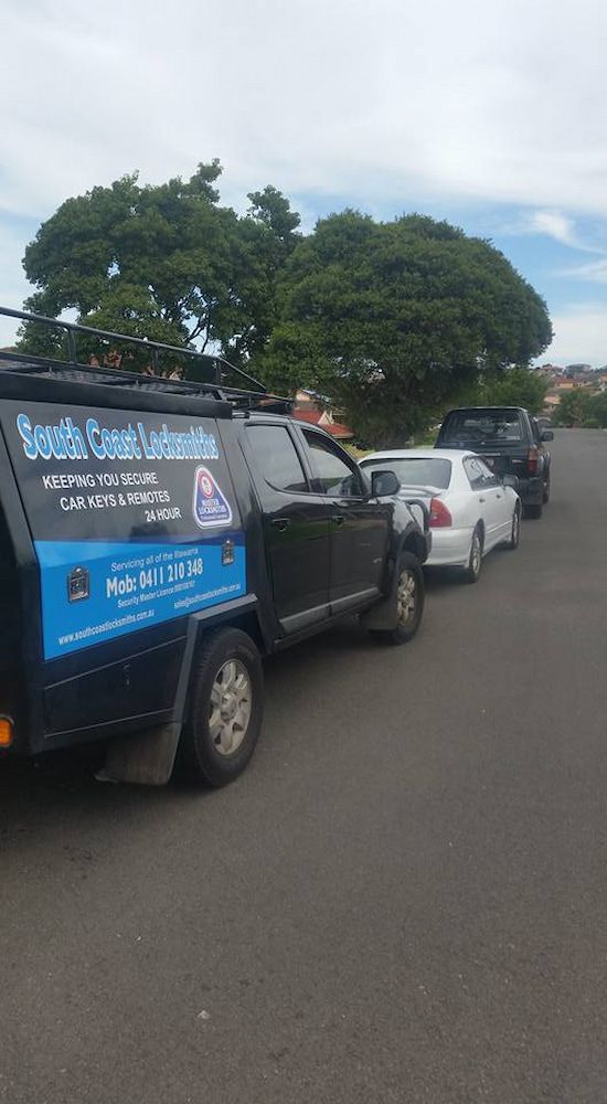 A Row of Cars Are Parked in a Parking Lot — South Coast Locksmiths in Gerringong, NSW