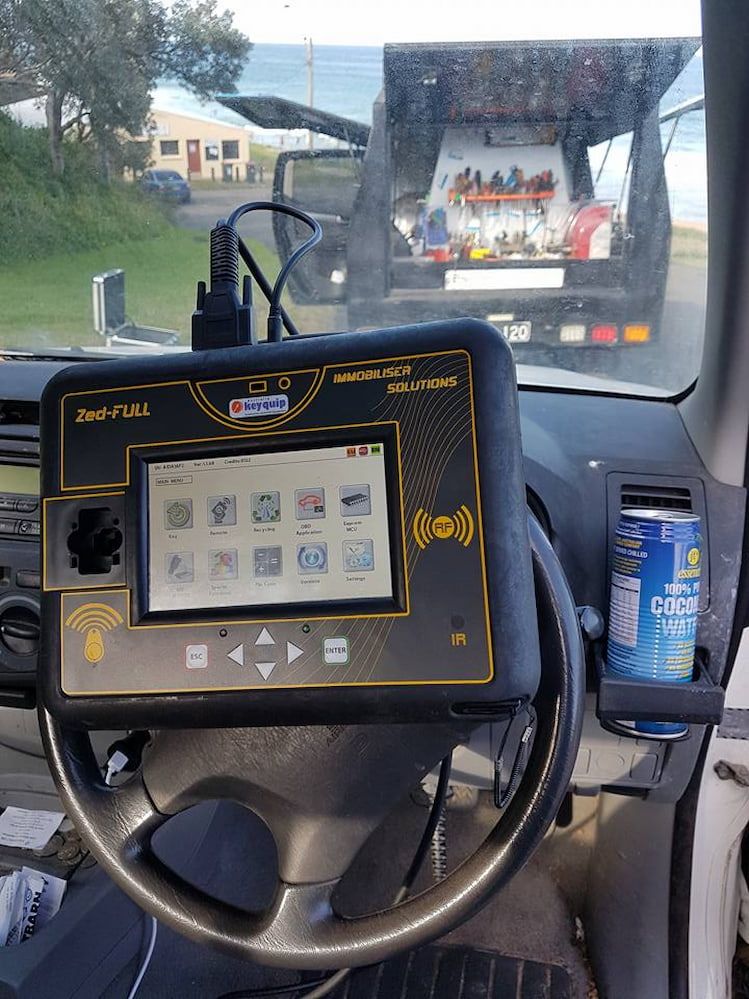 The Inside of a Car With a Tablet on the Steering Wheel — South Coast Locksmiths in Dapto, NSW
