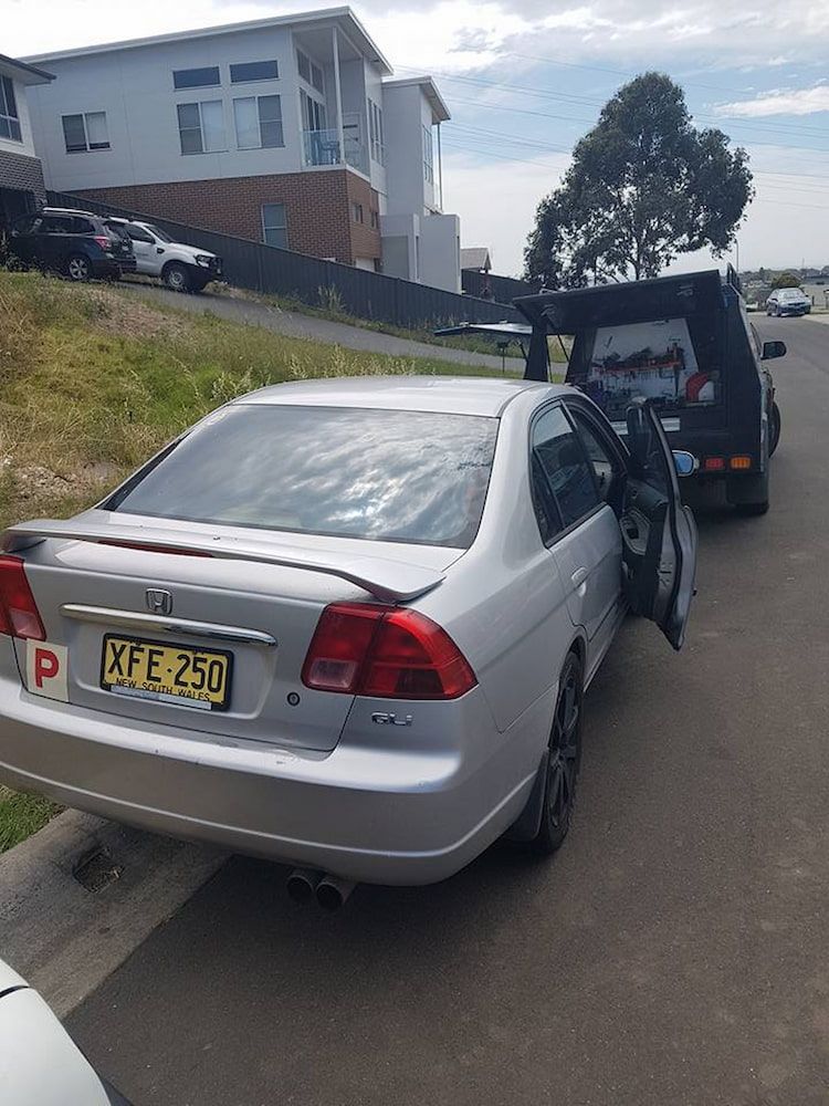 A Silver Car With a License Plate — South Coast Locksmiths in Warrawong, NSW