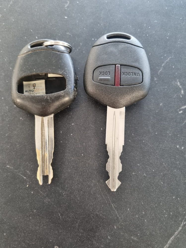 Two Keys Are Sitting Next to Each Other on a Table — South Coast Locksmiths in Shellharbour, NSW