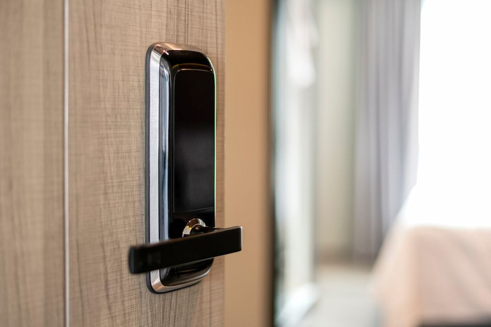 A Close Up of a Digital Door Lock on a Wooden Door — South Coast Locksmiths in Gerringong, NSW