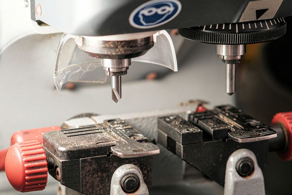 A Close Up of a Machine That is Cutting a Key — South Coast Locksmiths in Thirroul, NSW
