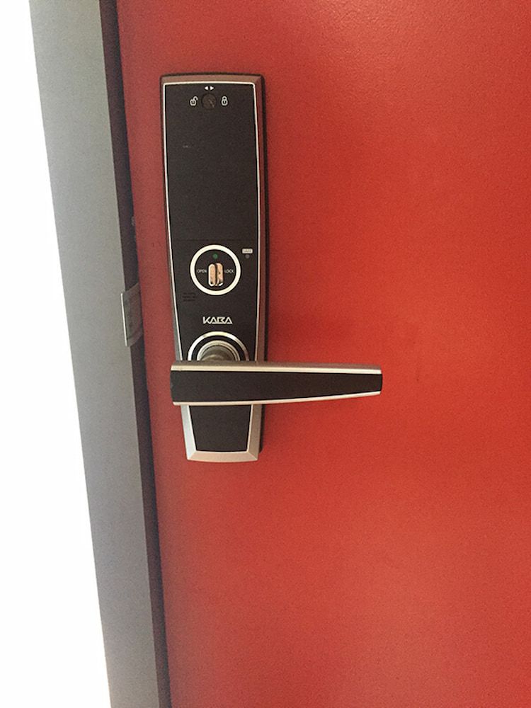 A Close Up of a Door Lock on a Red Door — South Coast Locksmiths in Fairy Meadow, NSW