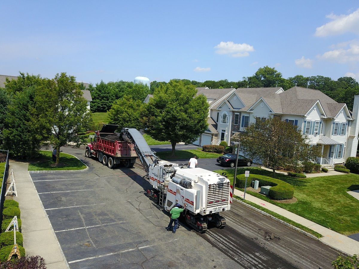 Equipment repaving a community road