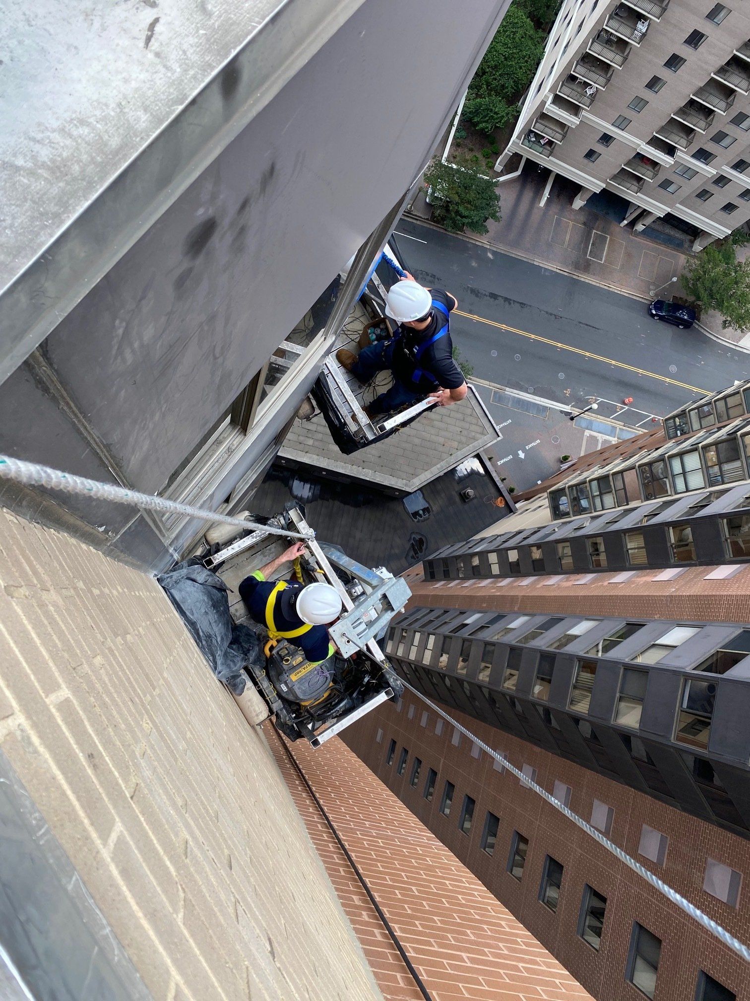 men on rope descent system