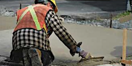Worker installing concrete
