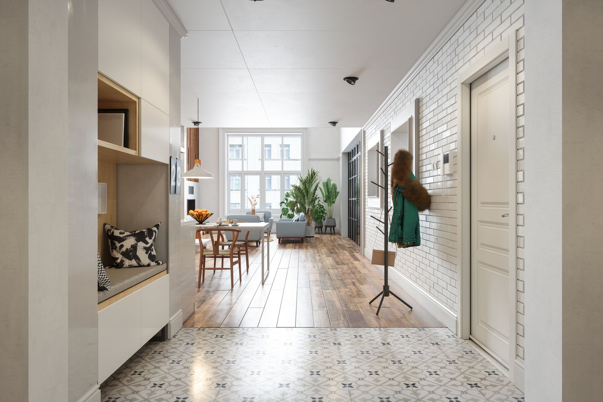 A hallway with a brick wall and a wooden floor leading to a living room and dining room.