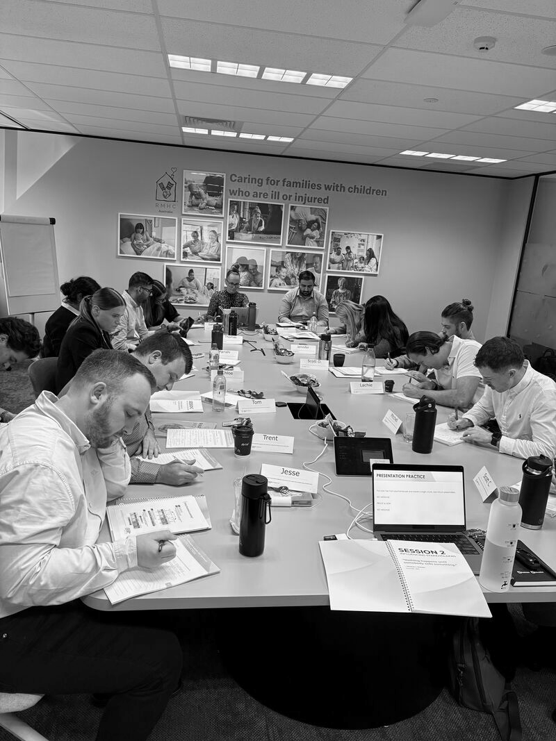 Leaders completing a presentation activity in a leadership programme.