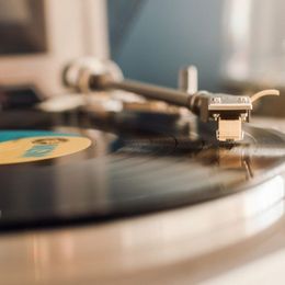 a close up of a record player playing a record .