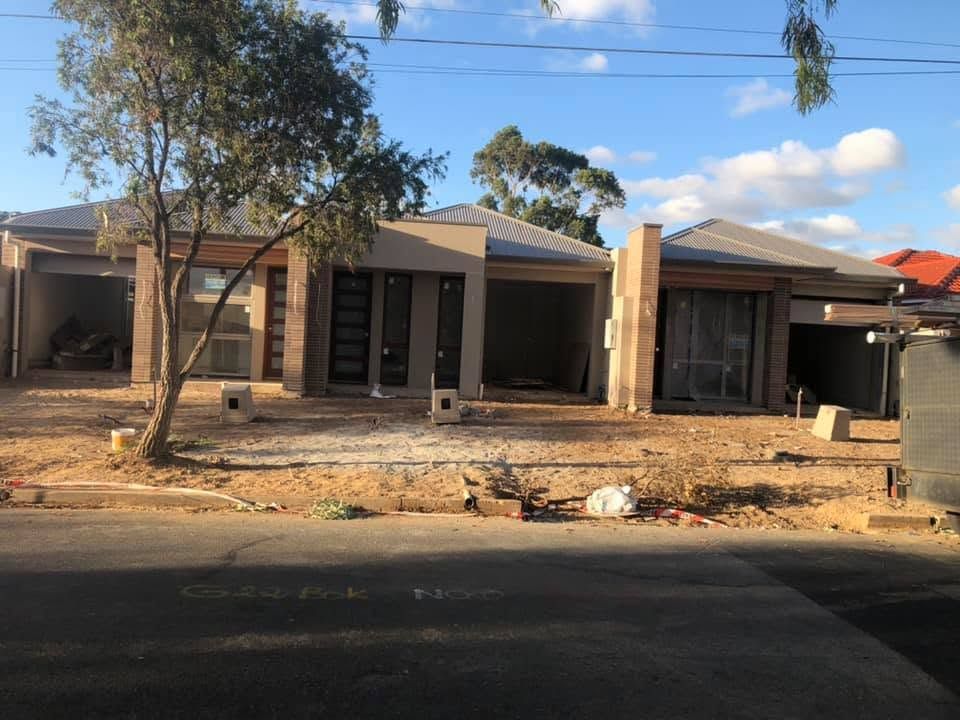 Residential builder reviewing home plans in Adelaide
