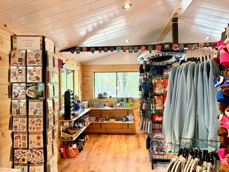A store filled with lots of clothes and cards.