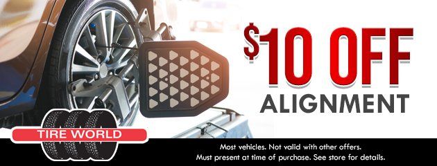 Tire World coupon: $10 off an alignment, featuring a car wheel with alignment equipment and promotional text.