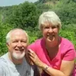 A man and a woman are posing for a picture together.