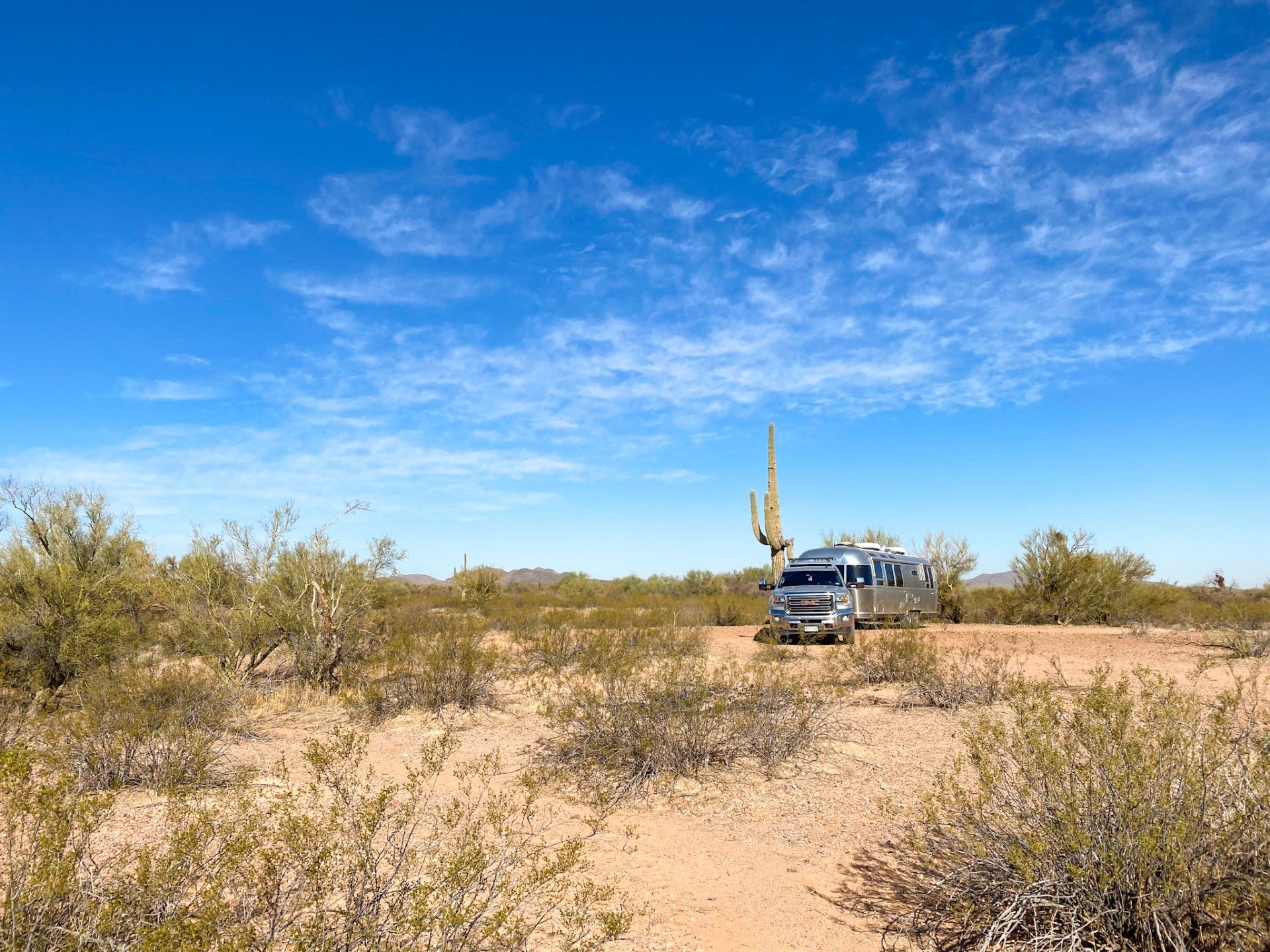 15 RV Essentials for the RV Beginner. Photo of an Airstream RV travel trailer boondocking