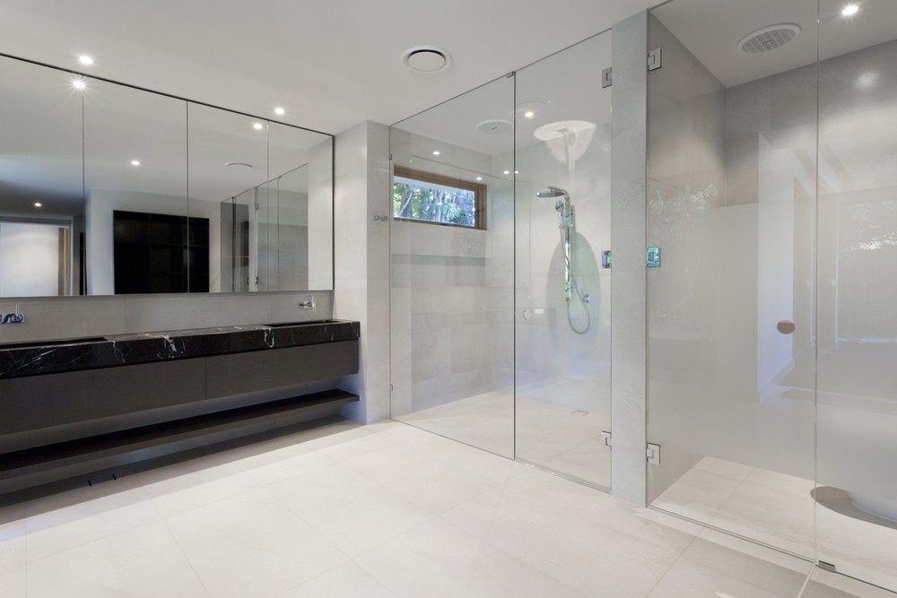 A Bathroom With A Walk In Shower And Two Sinks — Northern Glazing Glass & Aluminium In Smithfield, QLD