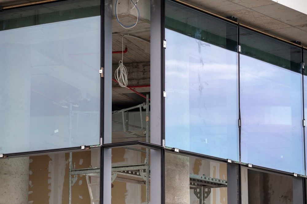 A Building Under Construction With A Lot Of Windows And Scaffolding — Northern Glazing Glass & Aluminium In Smithfield, QLD