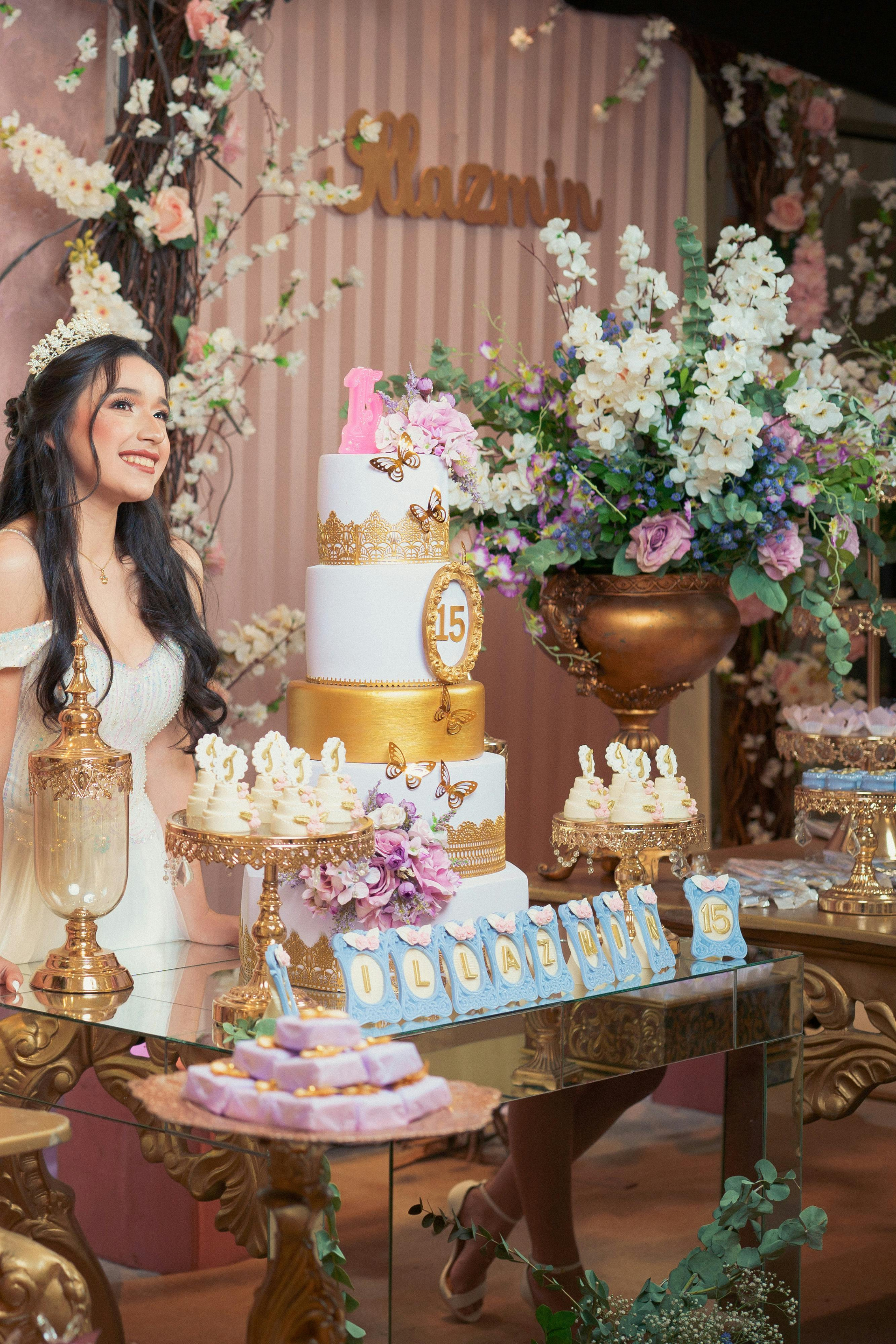 Quinceañera celebration with tiered cake display at The R.F. Strickland Co. event venue.