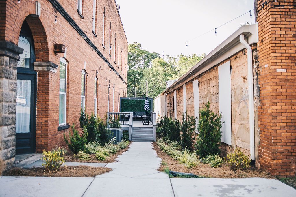 Charming brick walkway and outdoor event space at The R.F. Strickland Co. wedding venue.