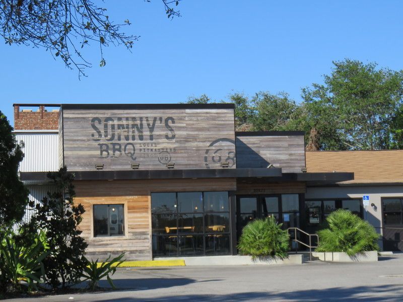 A wooden building with a sign that says sonny 's bbq