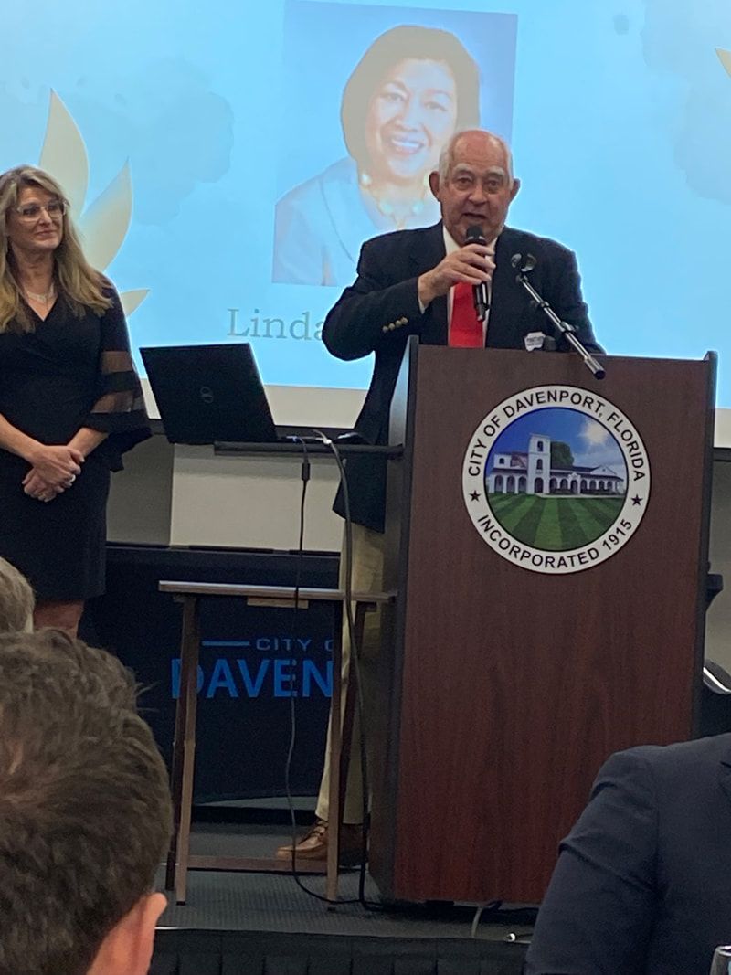 A man is giving a speech at a podium that says city of haven