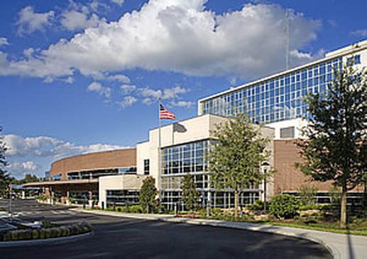 A large building with a flag on top of it.