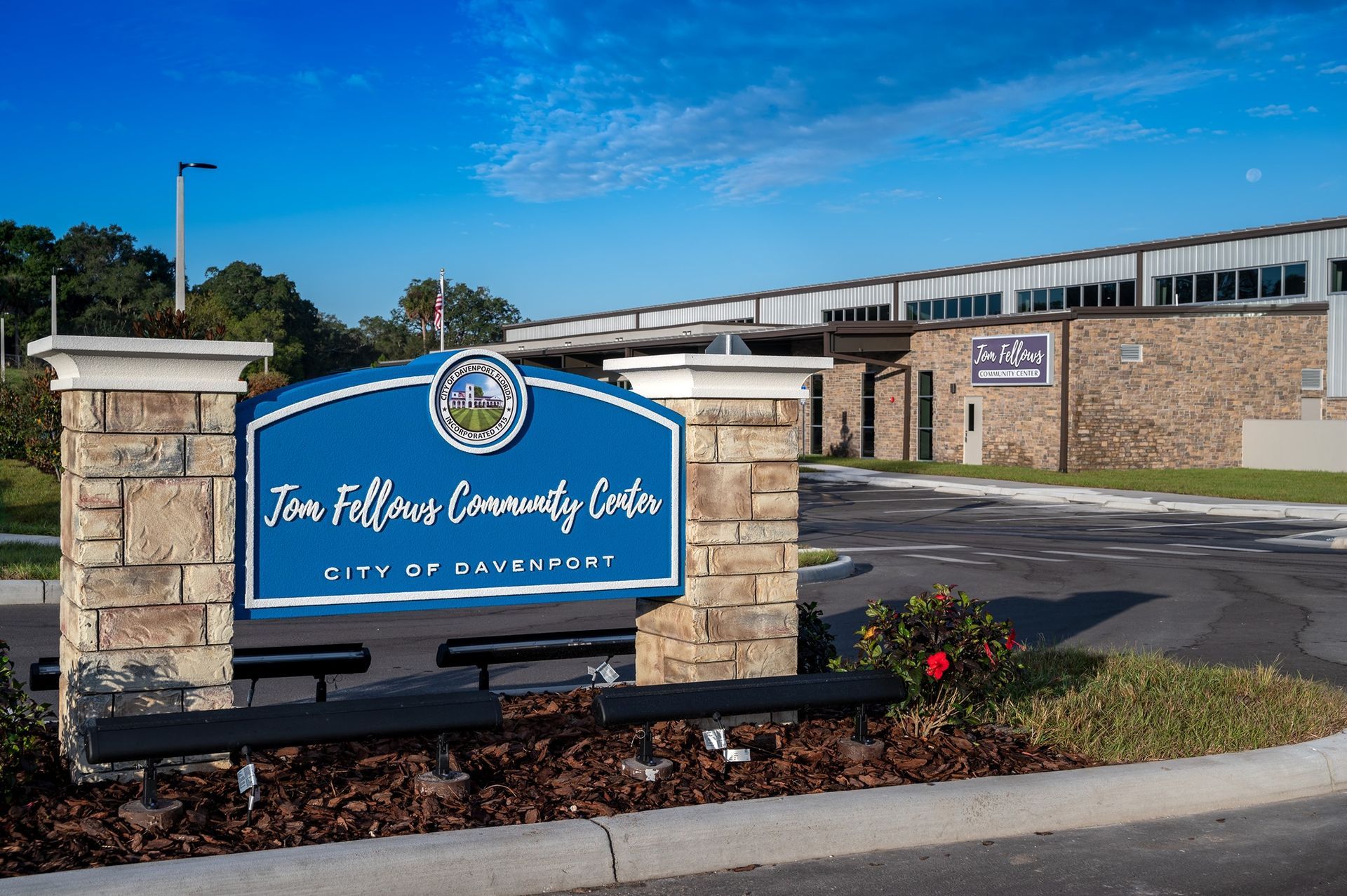 A blue sign that says ' time fellows community center ' on it