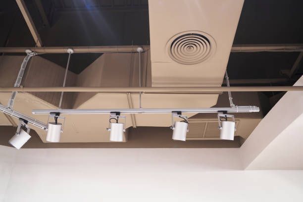 A Ceiling with A Row of Lights Hanging from It — Greensboro, NC — Blackdog Handyman Service Inc.