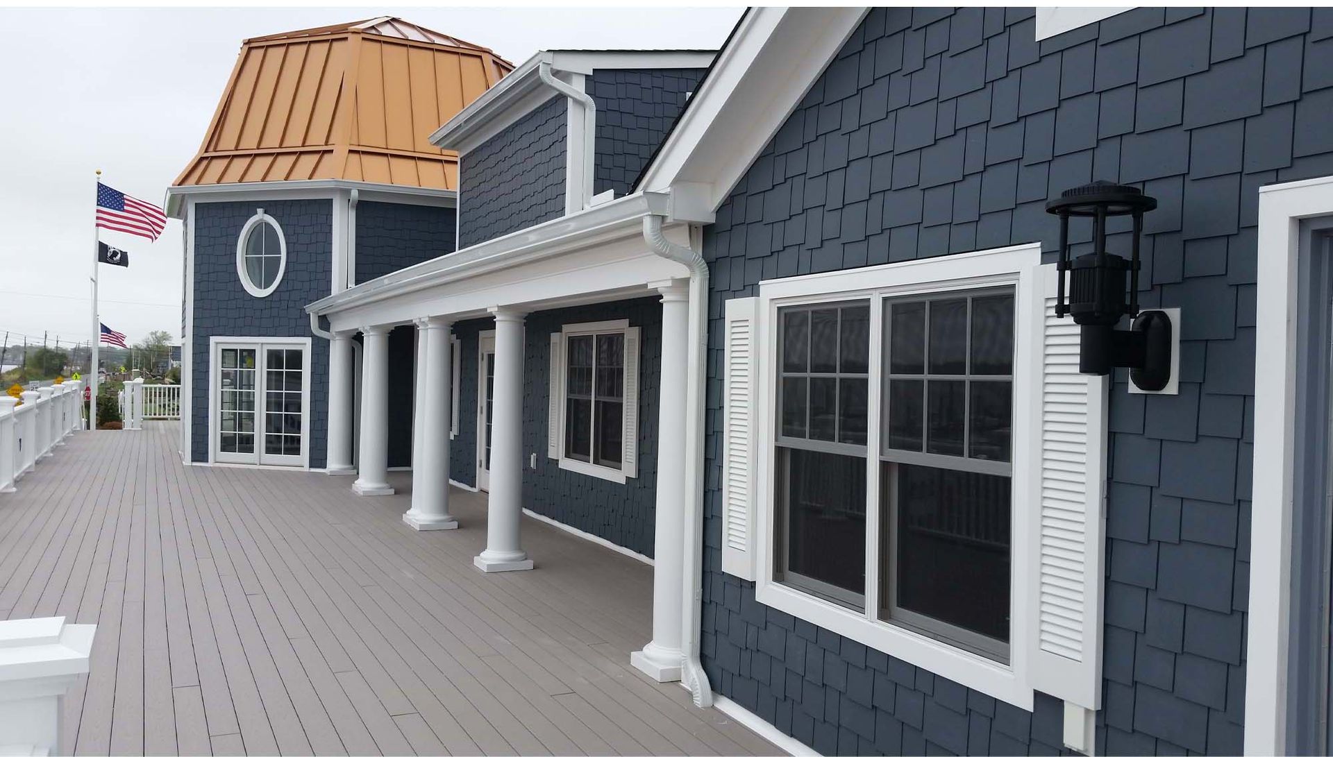 A blue house with white trim and shutters.
