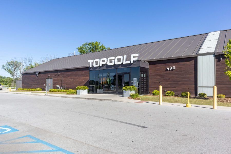 A large brick building with the word topgolf on it
