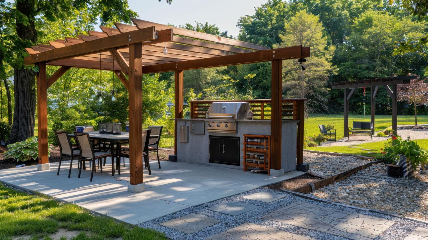 Outdoor patio with a wooden pergola over a dining table and a stone grill station, situated in a grassy backyard.