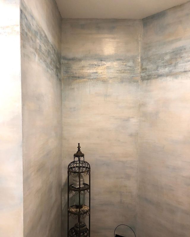 A small, painted corner with an abstract landscape design.