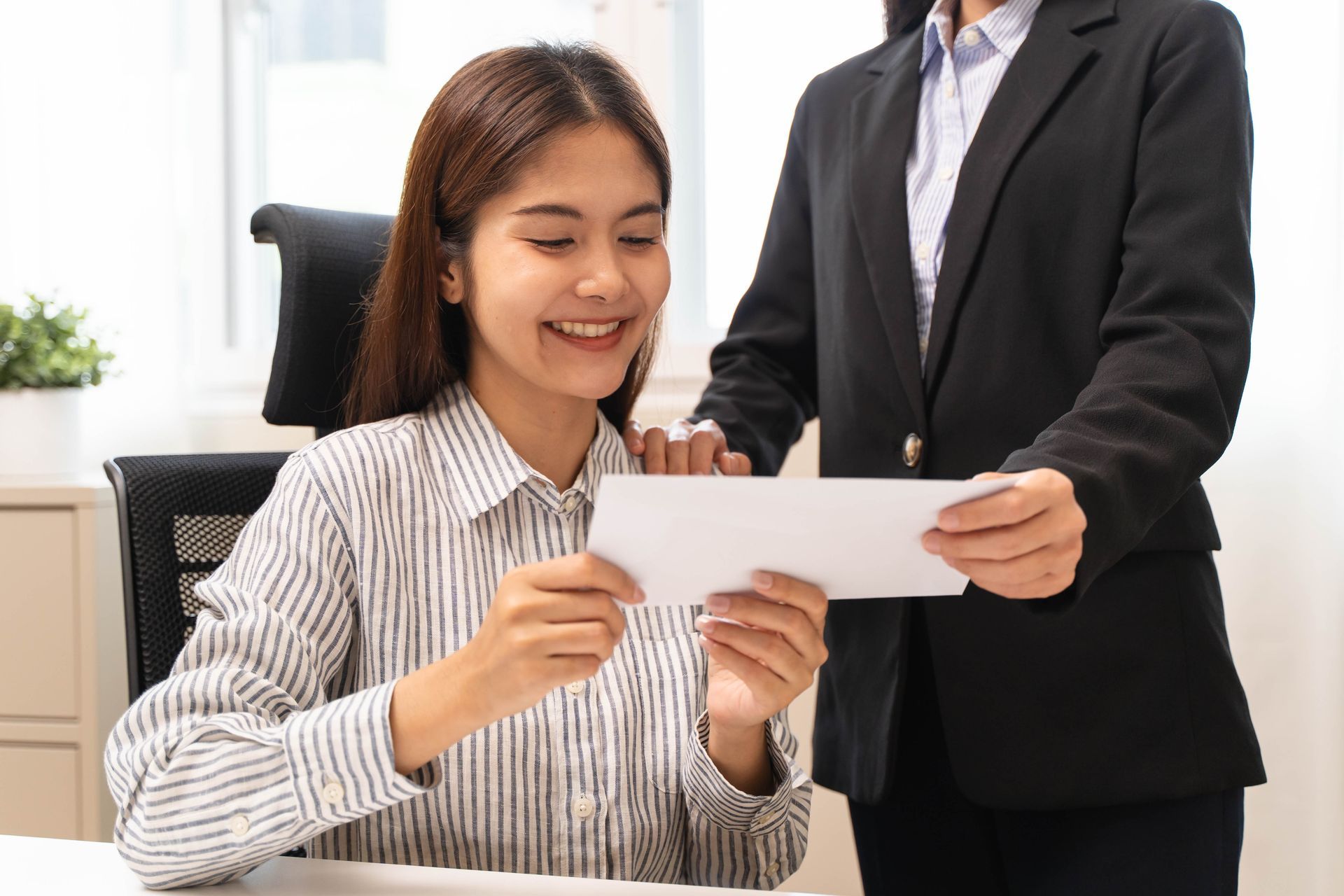 Payroll and overtime documents with calculator, coffee, pen, glasses, and folders on a desk