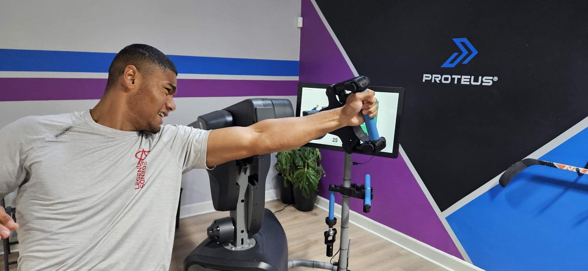 A man is doing exercises on a machine in a gym.