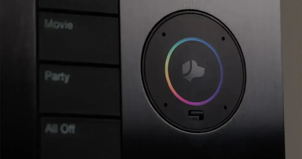 Control panel with button and colored ring, labeled