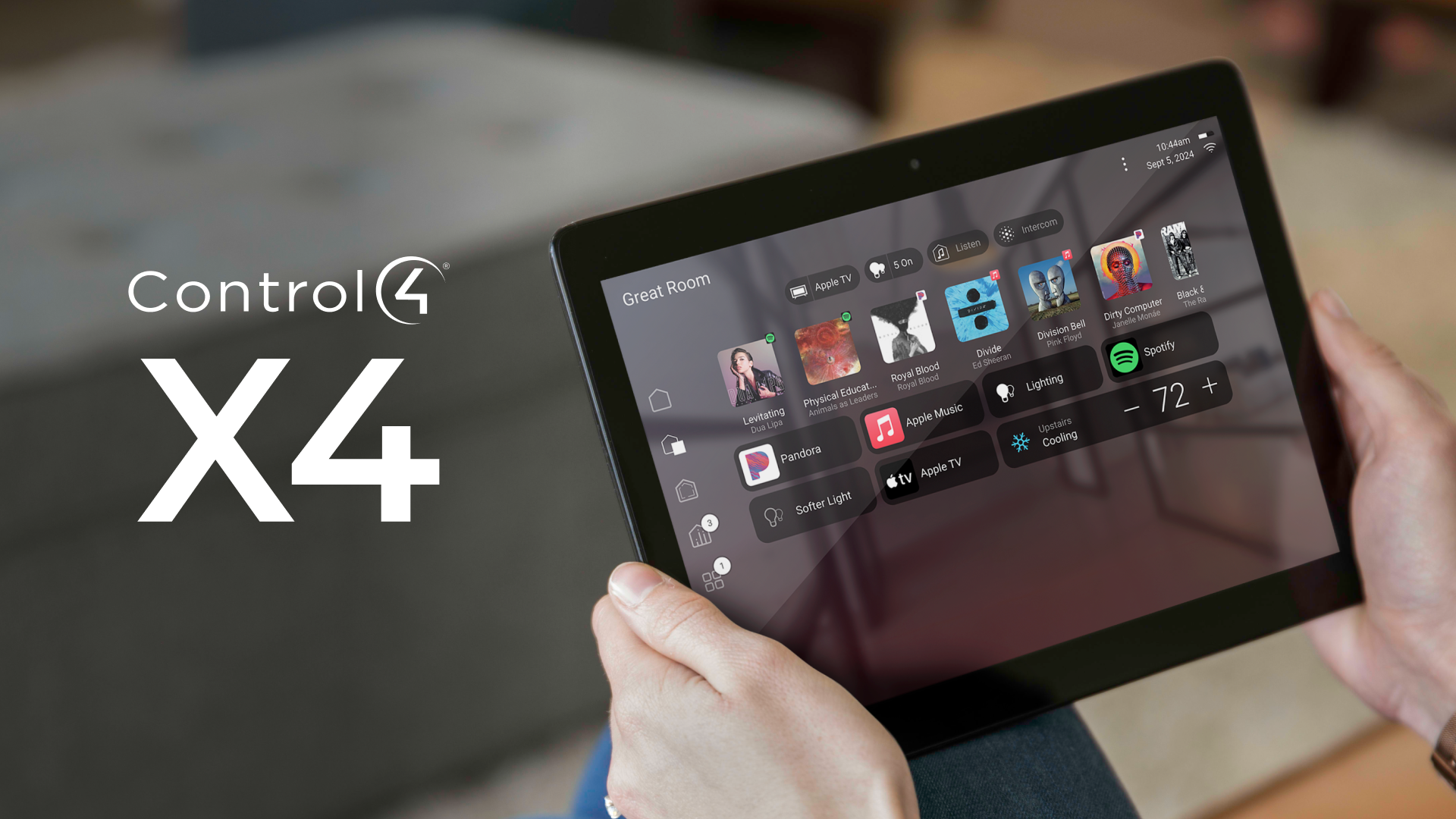 Person holding a tablet displaying a smart home control interface, Control4 X4 logo in the corner.
